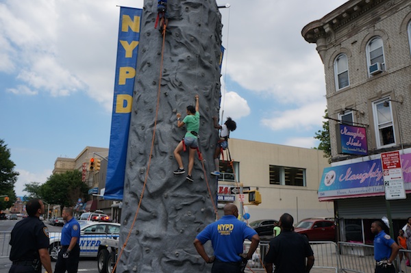 Uni Librarian Stephanie Yee likes challenges. On her break, she took on the NYPD climbing wall which was set up next to us.