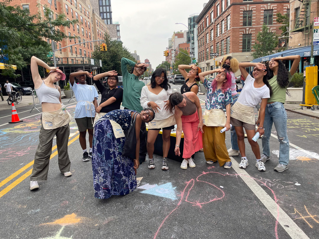 A group photo of teenagers expressing what heat looks like through their poses.