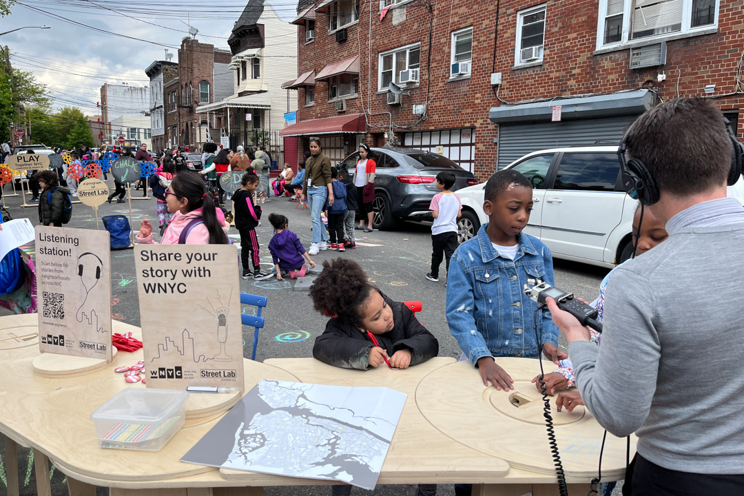 kids sharing their stories with a WNYC radio host on the street