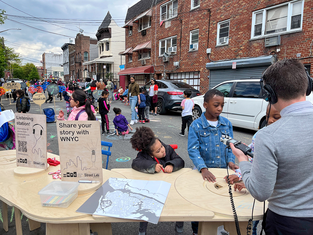 kids sharing their stories with a WNYC radio host on the street