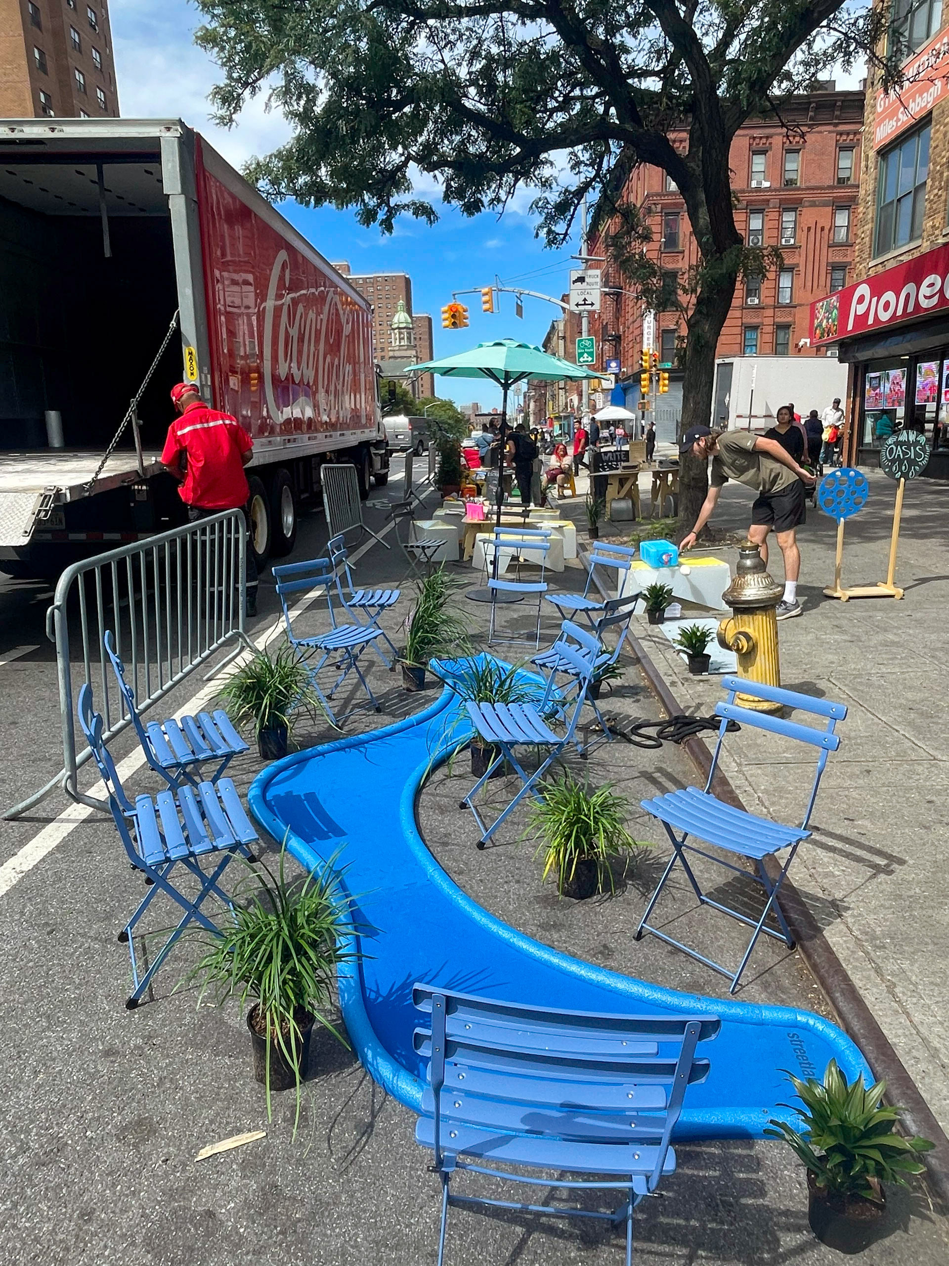 a car-free open street with children and adults engaging in different activities