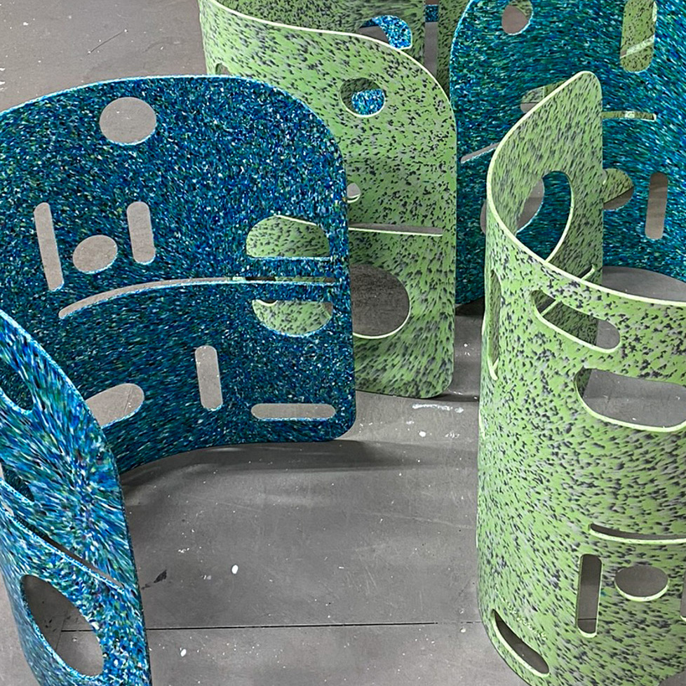 A cropped photograph of colorful recycled plastic shells for a chair.