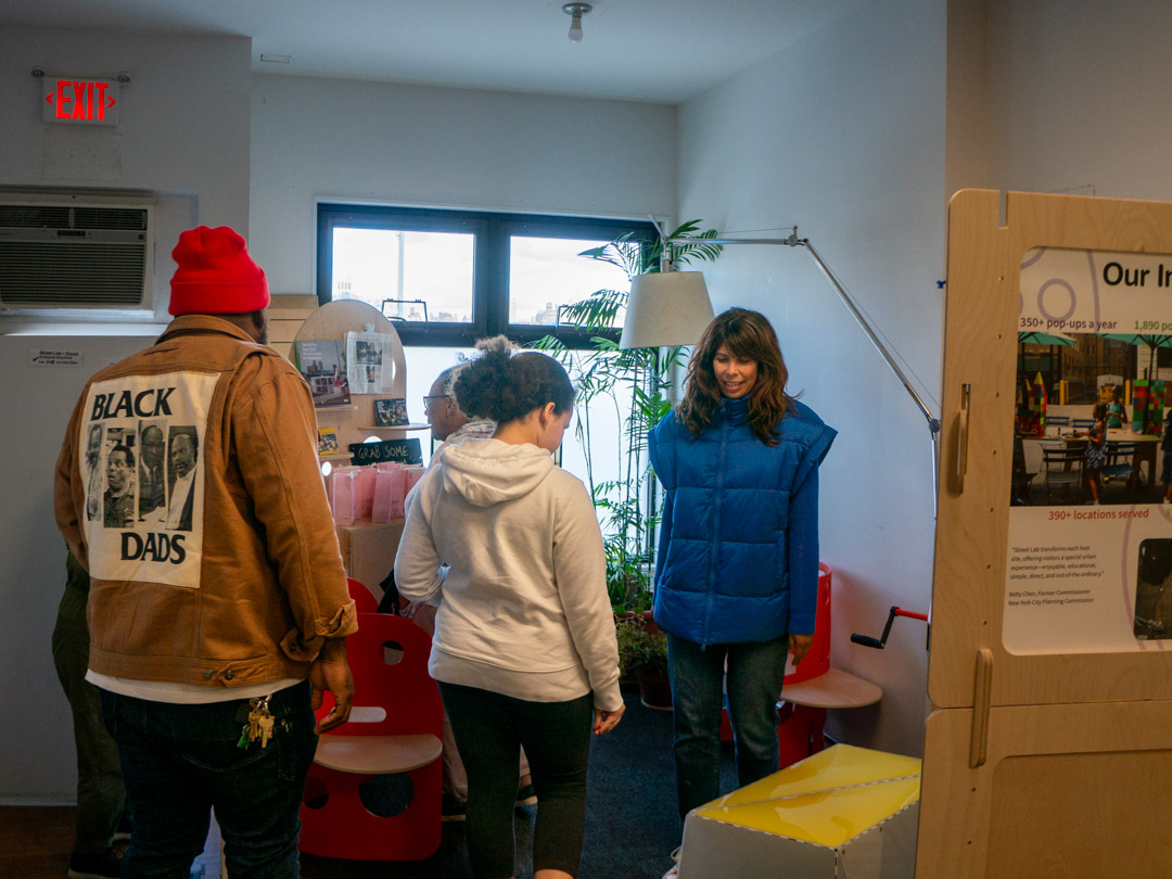 People talking with each other in an exhibit.