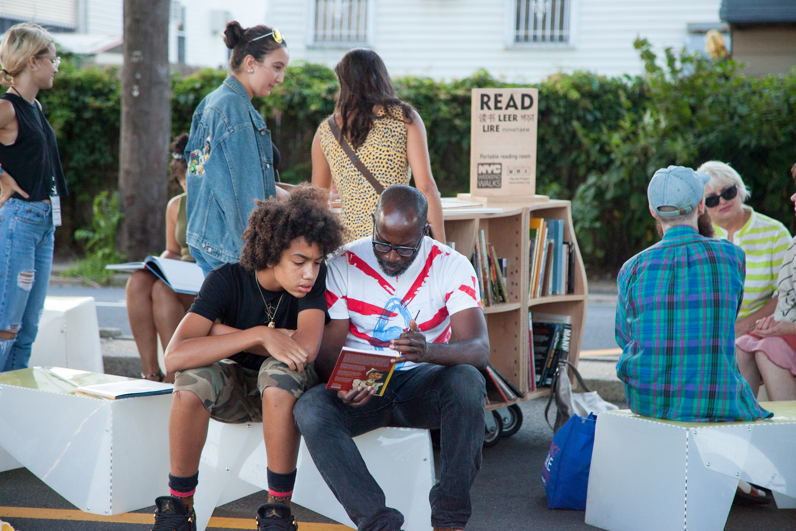 People reading on the street.