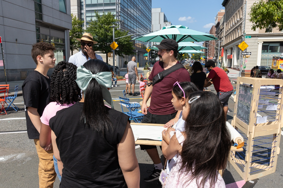 A community engagement session happening on an street.