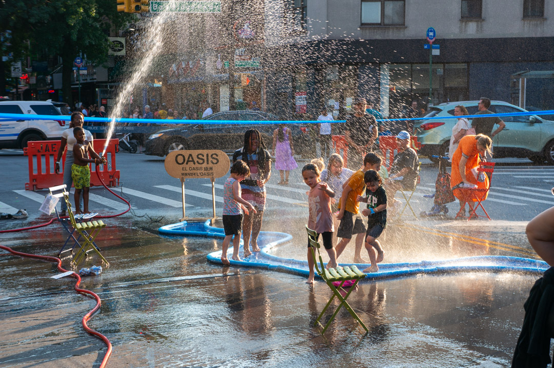 A view of a street with colorfully designed pop-up structures.