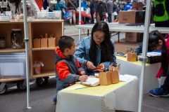 Chanyuan helps a young patron